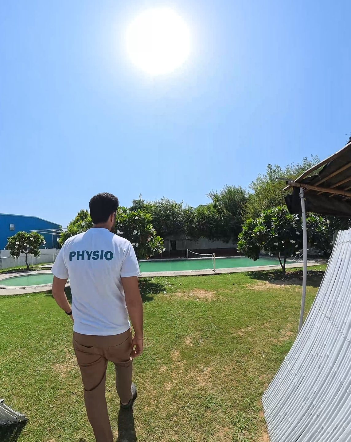 Physiotherapist walking toward the hydro pool for an aquatic rehab session