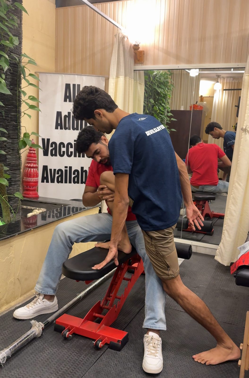 Therapist helping a patient with an assisted stretch on a bench